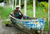 Man working on a fishing boat in Livingston, Guatemala